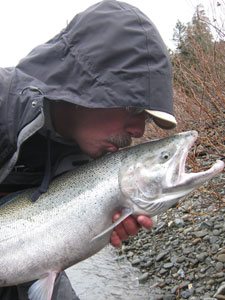 steelhead fisherman, holds the puff ball and bait right up